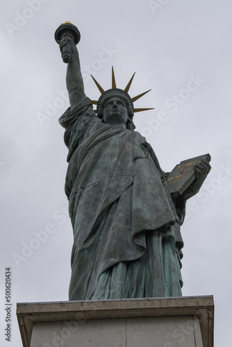 Paris, France, Europe: view of the replica of the Statue of Liberty made by Frederic Auguste Bartholdi in 1889 at the end of the Ile aux Cygnes (Swan Island) on the river Seine photo