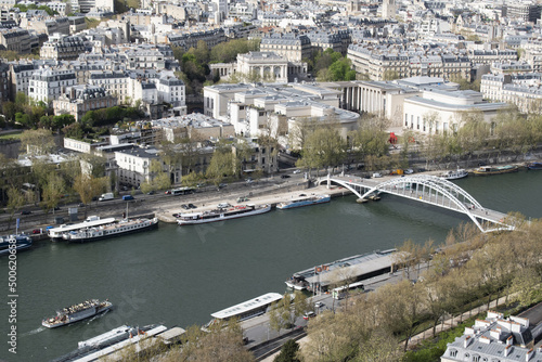 Paris, France, Europe: aerial view from the top of the Eiffel Tower with river Seine, boats on left and right banks (rive gauche and rive droite) and pedestrian and cycle bridge Passerelle Debilly photo