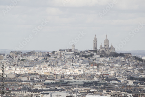 Paris, France, Europe: aerial view from the top of the Eiffel Tower with Montmartre hill, the highest point in the city, and Basilica of the Sacred Heart, Roman Catholic church completed in 1914 