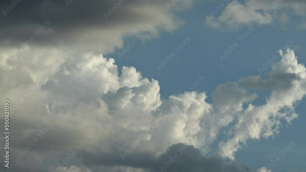 Puffy cumulus clouds swirl at sunset . Time lapse, relaxation dramatic beauty of weather atmosphere relaxation background rolling cumulus clouds Puffy cumulus clouds swirl at sunset . Time lapse, relaxation dramatic beauty of weather atmosphere relaxation background rolling cumulus clouds
