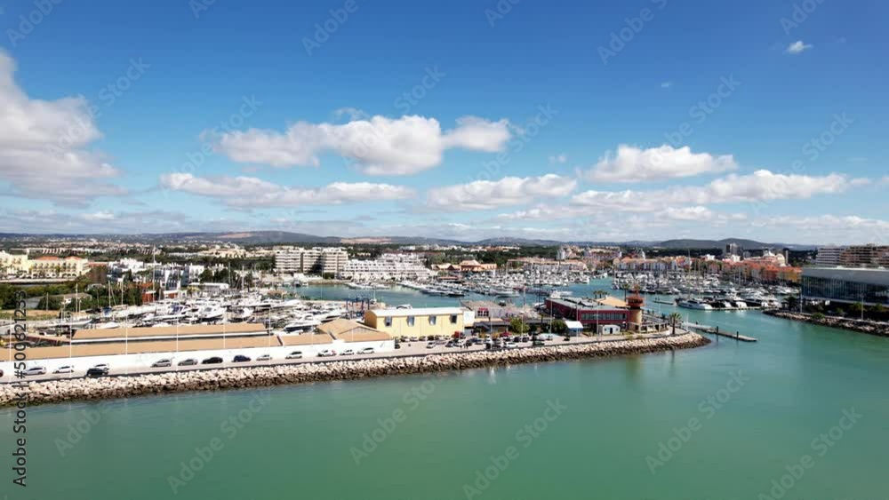 Vilamoura, Portugal - April 13, 2022: Aerial view approaching Vilamoura Marina in Algarve, Portugal on a sunny day Vilamoura, Portugal - April 13, 2022: Aerial view approaching Vilamoura Marina in Algarve, Portugal on a sunny day