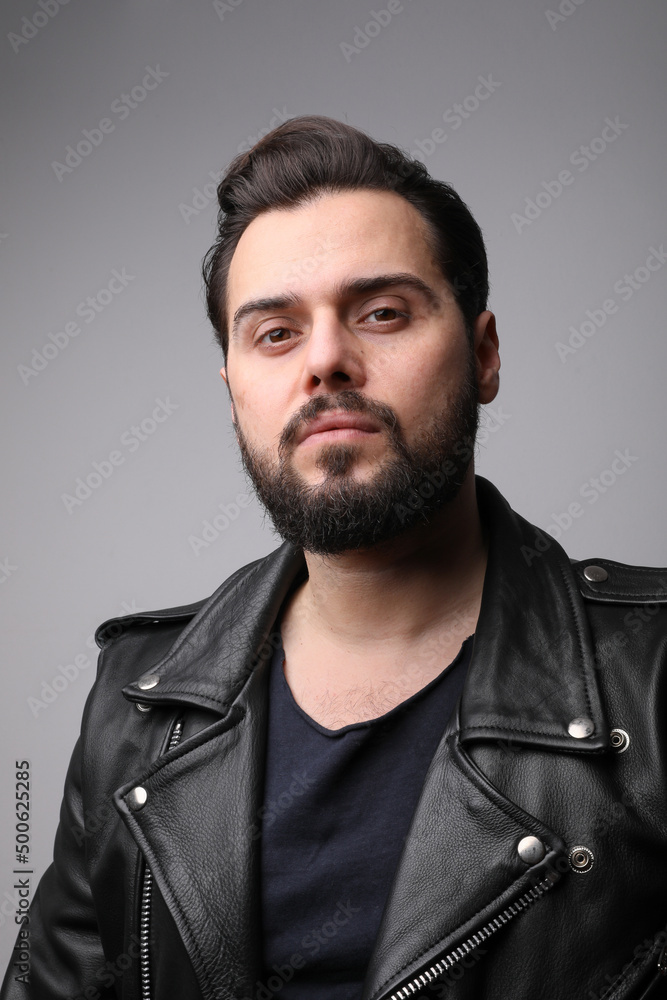 Bearded handsome young man with strong mindset concept. Vertical.
