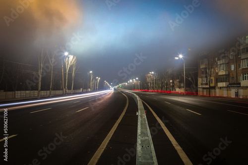 Fog over night city highway