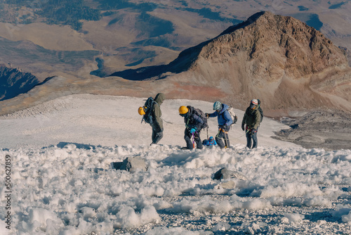 Winter trekking scene in the volcano pico de orizaba in mexico photo