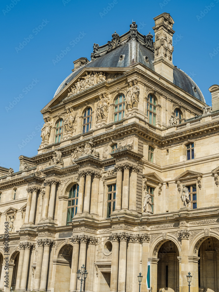 Pavillon Richelieu of the Louvre Palace with blue sky in Paris