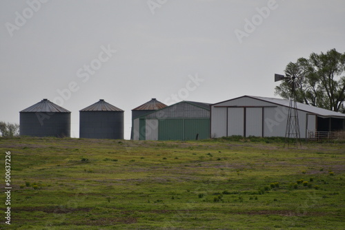 Grain Bins and Barns in a Farm Field