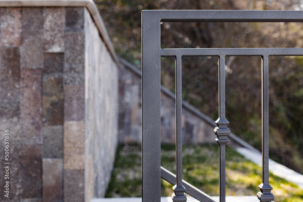 Modern metal railings and handrails in the loft style. The metal is treated with a primer and anti-corrosion paint. Interior design in industrial style. Modern metal railings and handrails in the loft style. The metal is treated with a primer and anti-corrosion paint. Interior design in industrial style.