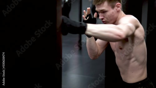 In the A gym black beats grsh man in bandages boxer training slow, from studio glove in exercise and young fighter, ring oxer. Athletic challenge gym, kick photo