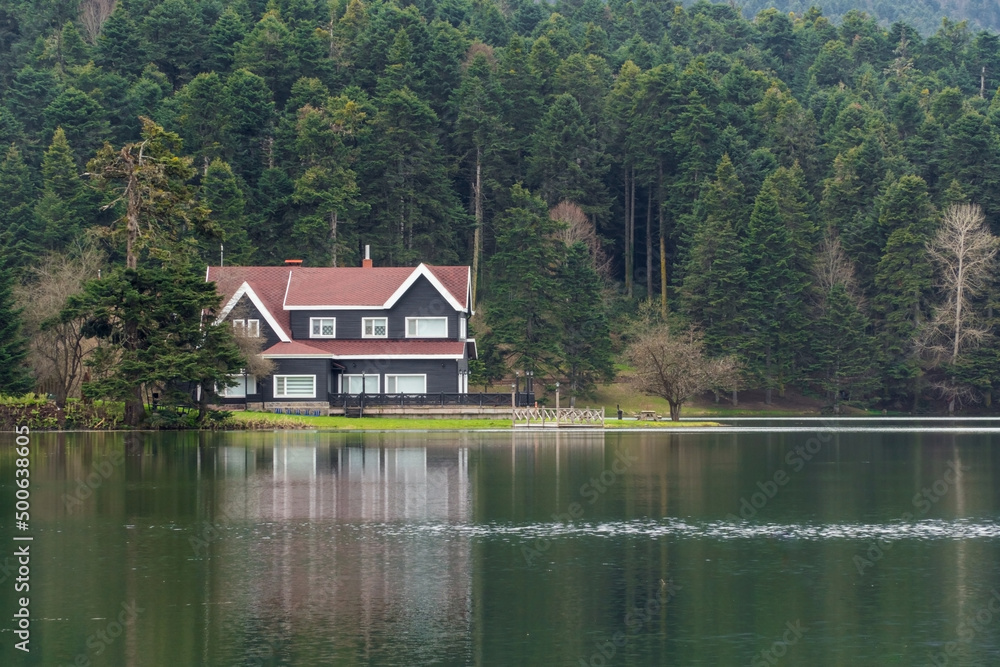 Naklejka premium Bolu Golcuk Tabiat Parki. Bolu National Park. Landmarks or touristic places of Turkey. Wooden green house by the lake. 