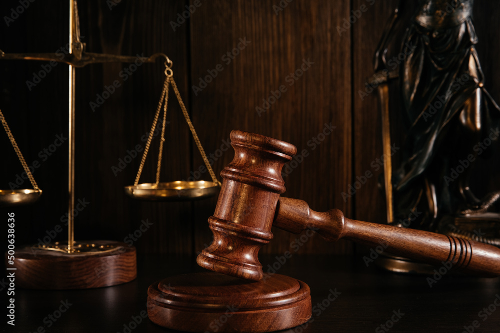 Wooden gavel close-up, scales and lady of justice Wooden gavel close-up, scales and lady of justice