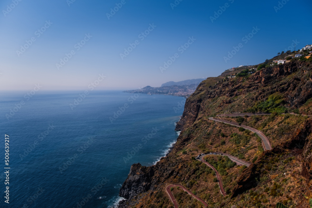 View of a road with many curves in Canico, Madeira on the coastline. October 2021