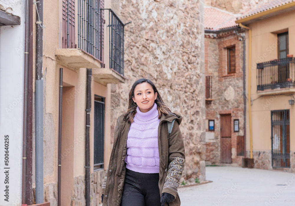 Buitrago de Lozoya local tourism in Madrid. Young Latin honduran woman travel on holiday trip