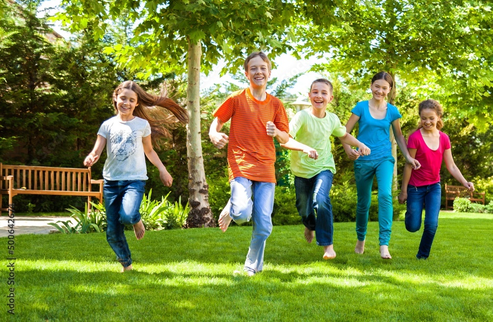 Portrait of Children Running in Park Portrait of Children Running in Park