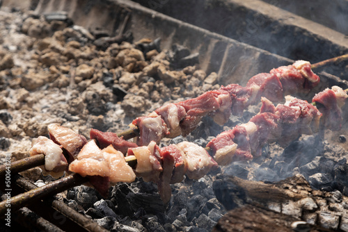 Skewers of traditional Espetada, cooking in a barbecue, Faial, Madeira, Portugal 