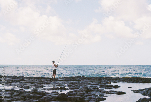 man fishing island