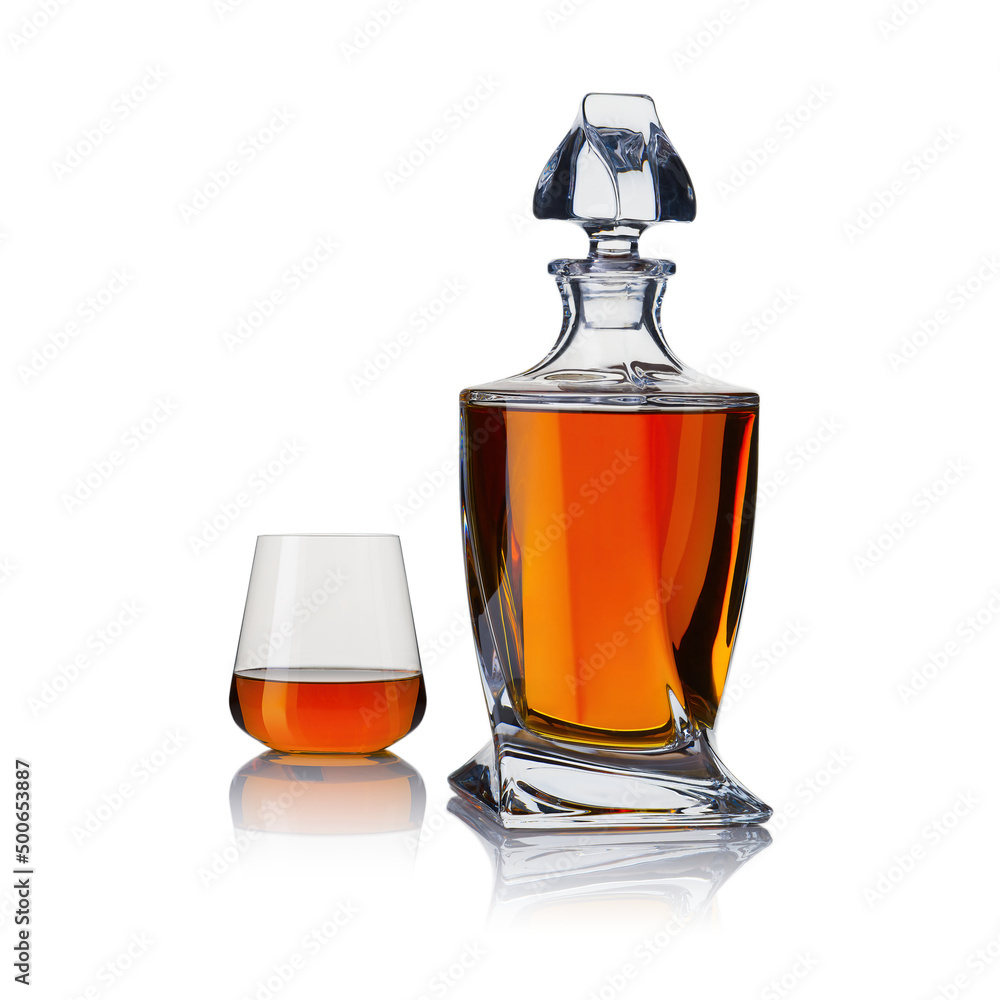 Decanter with whiskey and whiskey glasses. Carafe and glass of whiskey on a white background. Decanter with whiskey and whiskey glasses. Carafe and glass of whiskey on a white background.