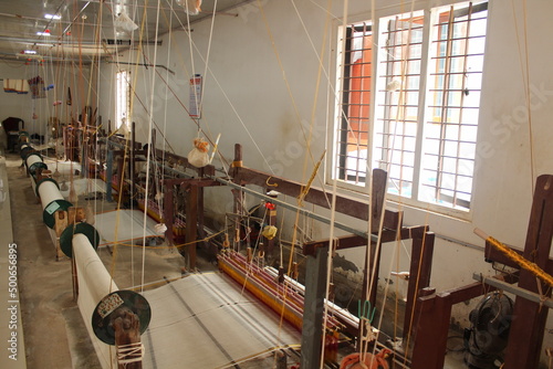 Weaving or Handloom Industry in India. Textile handicraft artisans. Spinning Cotton into thread. photo