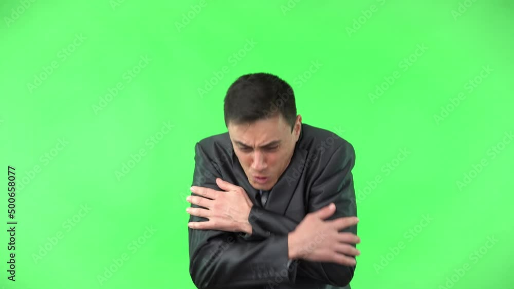 Freezing man in formal wear embracing himself Freezing man in formal wear embracing himself