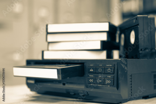 Canvastavla Pile of video cassette tape VHS with video playback old retro style stack concept of vintage electric and electronic appliances multimedia record player device old fashioned