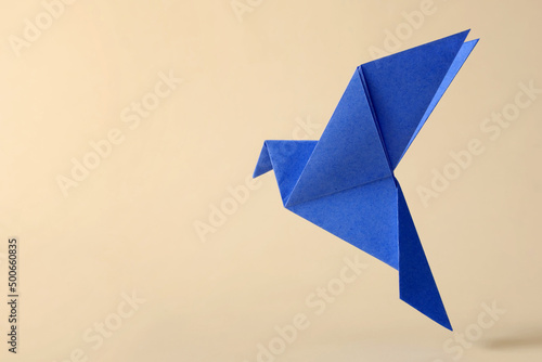 Pigeon flying minimal concept of japanese origami craft handmade toy.