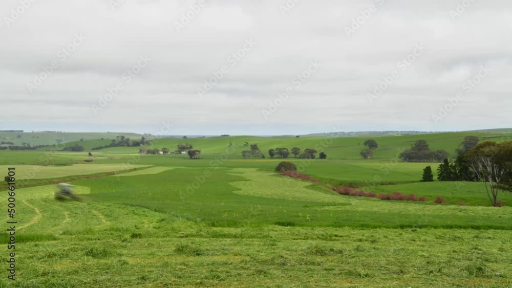 landscape timelapse of making hay and silage on a farm in victoria, australia landscape timelapse of making hay and silage on a farm in victoria, australia