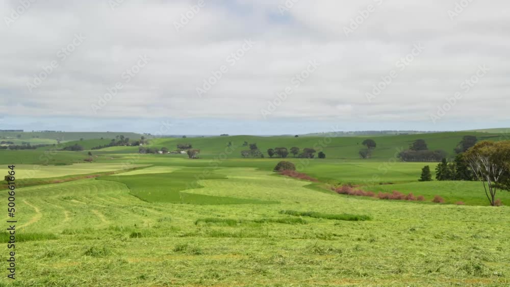landscape timelapse of making hay and silage on a farm in victoria, australia landscape timelapse of making hay and silage on a farm in victoria, australia