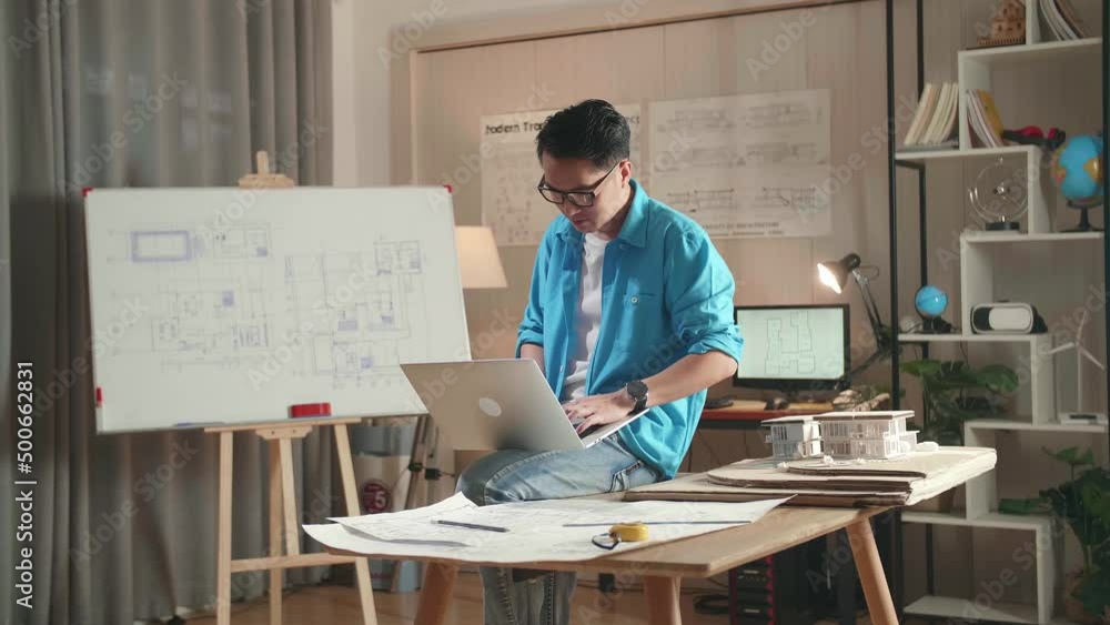 Asian Man Engineer Sitting On The Table And Using A Laptop To Work At The Office
Asian Man Engineer Sitting On The Table And Using A Laptop To Work At The Office
