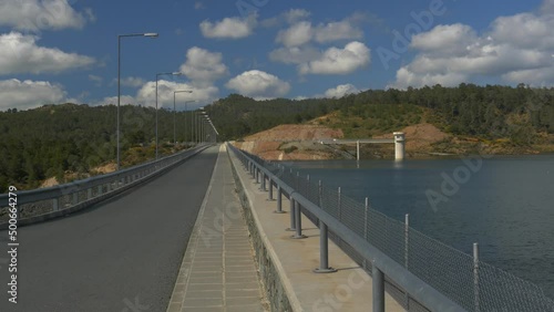 Kannaviou Dam and reservoir, Cyprus, with sunshine and clouds photo