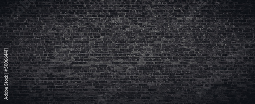 Photo Black or dark gray brick wall texture background