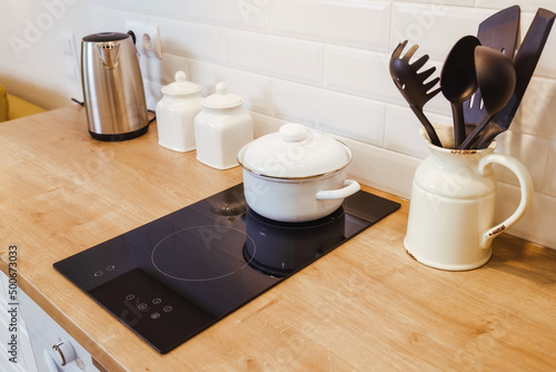 kitchen mockup with induction hob and wooden surface, copy paste