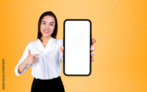 Businesswoman finger point with phone, mockup screen © ImageFlow