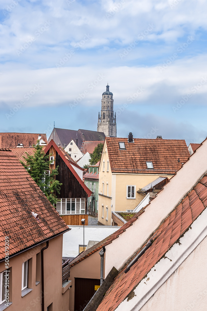 Nördlingen, Germany. Tiled roofs and towering cathedral towering over the city