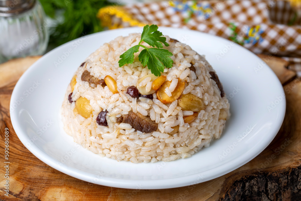 Traditional delicious Turkish food; rice pilaf with pine nuts and currants (Turkish name; bademli ic pilav or pilaf) Traditional delicious Turkish food; rice pilaf with pine nuts and currants (Turkish name; bademli ic pilav or pilaf)