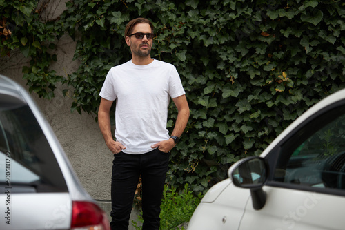 White blank t-shirt on a hipster handsome male model with space for your logo or design in casual urban style