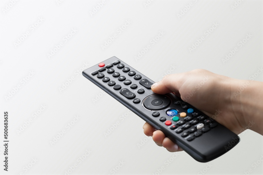 Remote control in human hand Remote control in human hand
