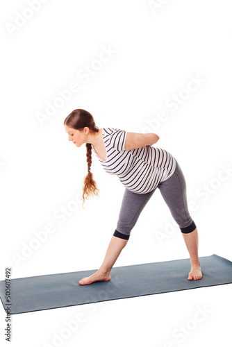 Pregnancy yoga exercise - pregnant woman doing yoga asana parsvottanasana Intense Side Stretch pose isolated on white background