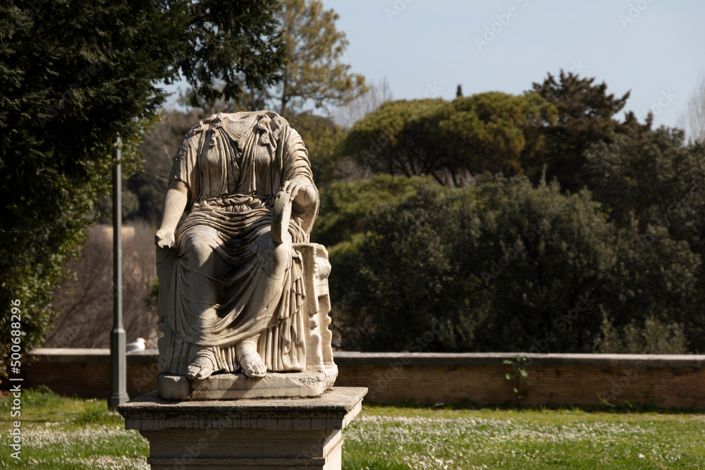 Obraz premium statue of a person in the park in rome; antique roman statue