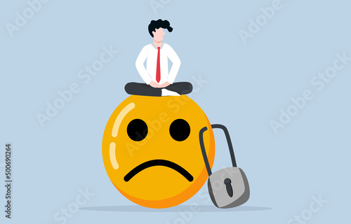 Meditation to control negative emotion not last long, mental health practising to be emotional intelligence person concept. Calm businessman meditating on frowning face that being padlocked.