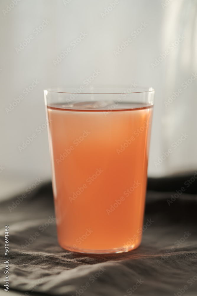 Guava drink in tumbler glass on linen cloth Guava drink in tumbler glass on linen cloth