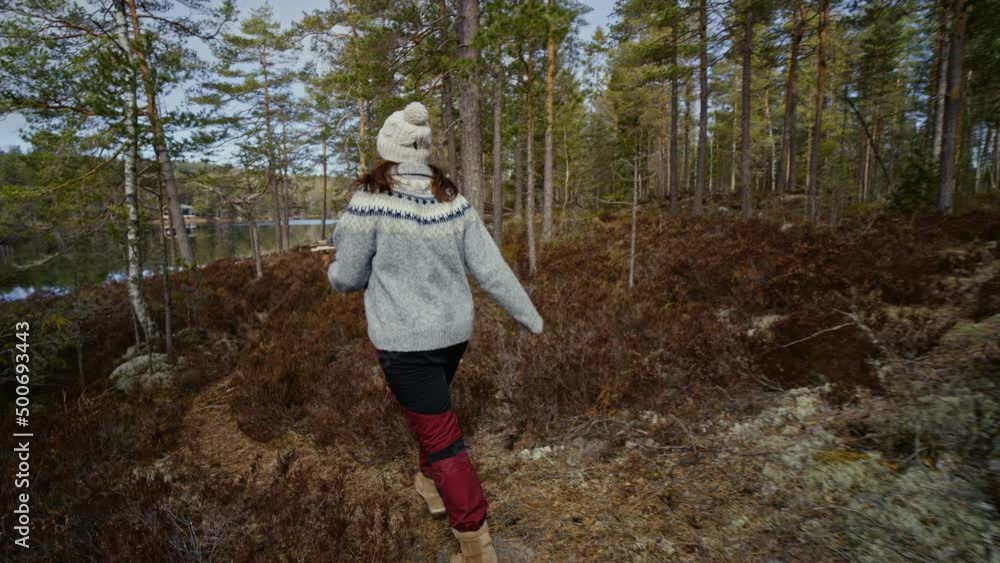 Girl walks forest in spring. A woman walks in the national park norway. slow motin Girl walks forest in spring. A woman walks in the national park norway. slow motin