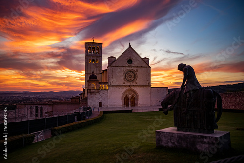 Colorful sunset over the Basilica of San Francesco in the city of Assisi - Italy