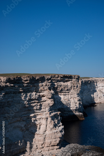 Beautiful landscape of the coastline near the ocean. Summer day. Hiking in the mountains and to the water.