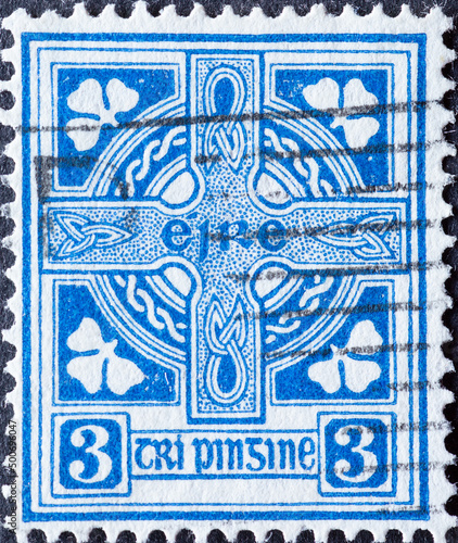 Ireland - circa 1940: a postage stamp from Ireland, showing the Celtic Cross with ornaments and decorations