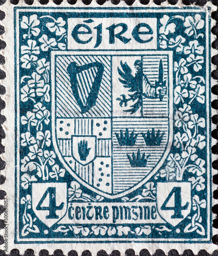 Ireland - circa 1940  a postage stamp from Ireland   showing the Coat of Arms of Ireland with ornaments and decorations . green