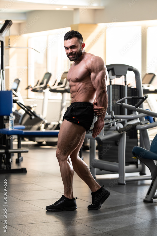 Bodybuilder Performing Side Chest Pose Stock Photo by ©ibrak 248607702