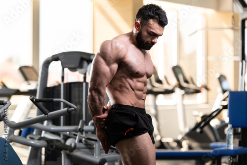 Muscular Man Is Hitting Side Triceps Pose