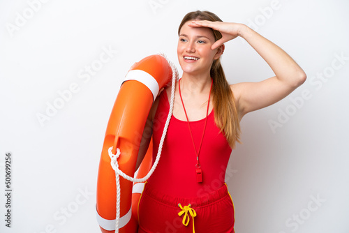 Young caucasian woman isolated on white background with lifeguard equipment and showing something