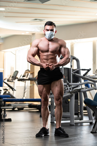 Portrait Of A Muscular Man Wearing Protective Mask © Jale Ibrak