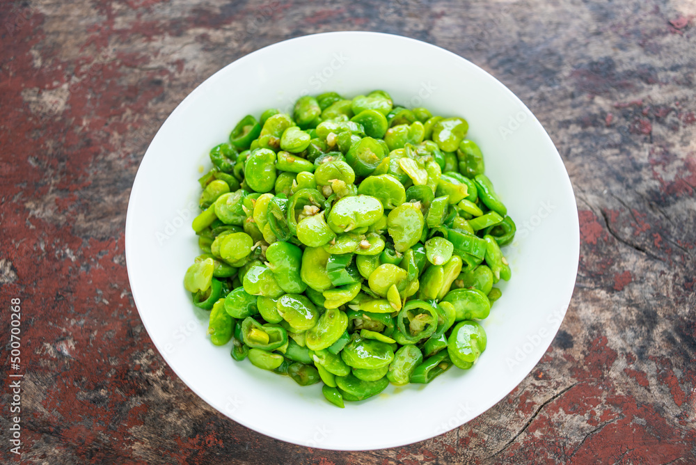 Fried broad beans with local vegetables and green peppers in Hunan, China Fried broad beans with local vegetables and green peppers in Hunan, China