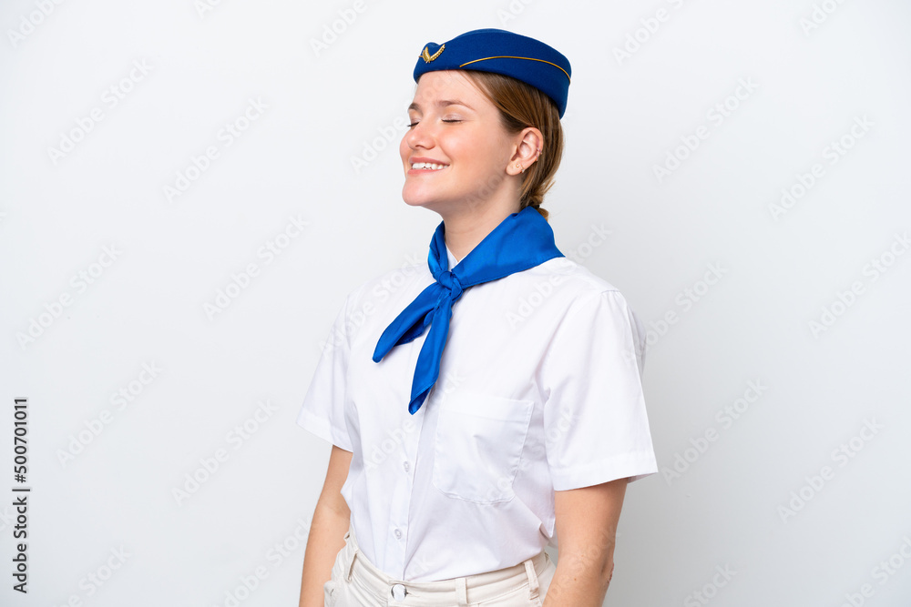 Airplane stewardess woman isolated on white background laughing in lateral position Airplane stewardess woman isolated on white background laughing in lateral position
